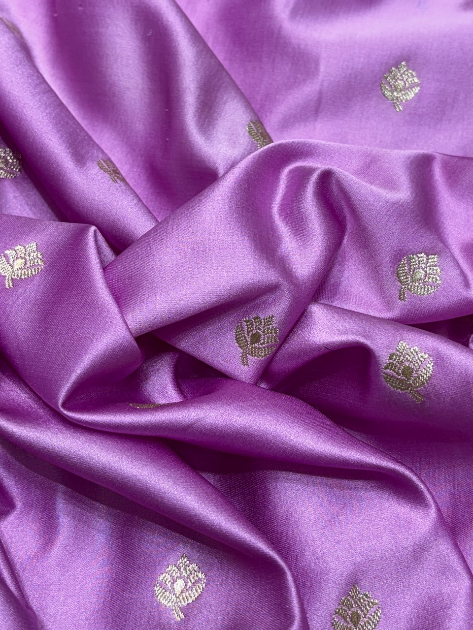 Purple fabric with gold embroidery patterns